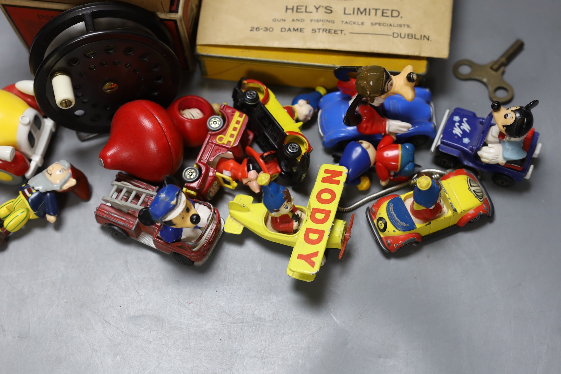 Three fishing reels, flies, lines etc., and a collection of Noddy and Mickey Mouse toys